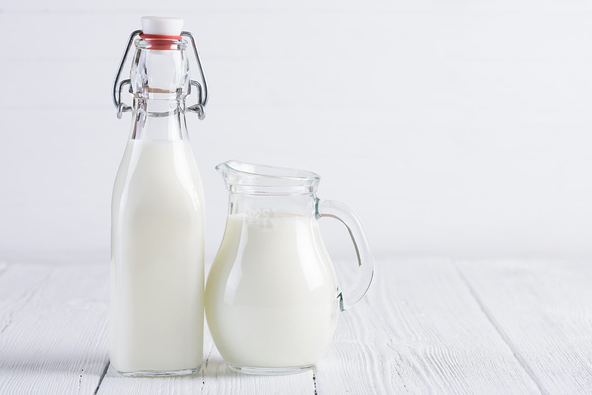 Jar With Milk And Vintage Bottle Of Milk