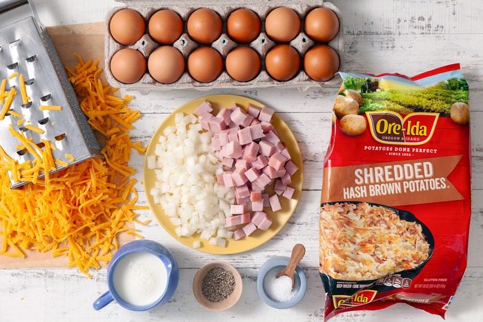 Eggs ham cheese and other ingredients on a table