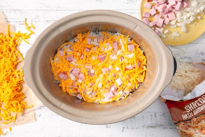 Diced ham, chopped onion and other ingredients in a large bowl