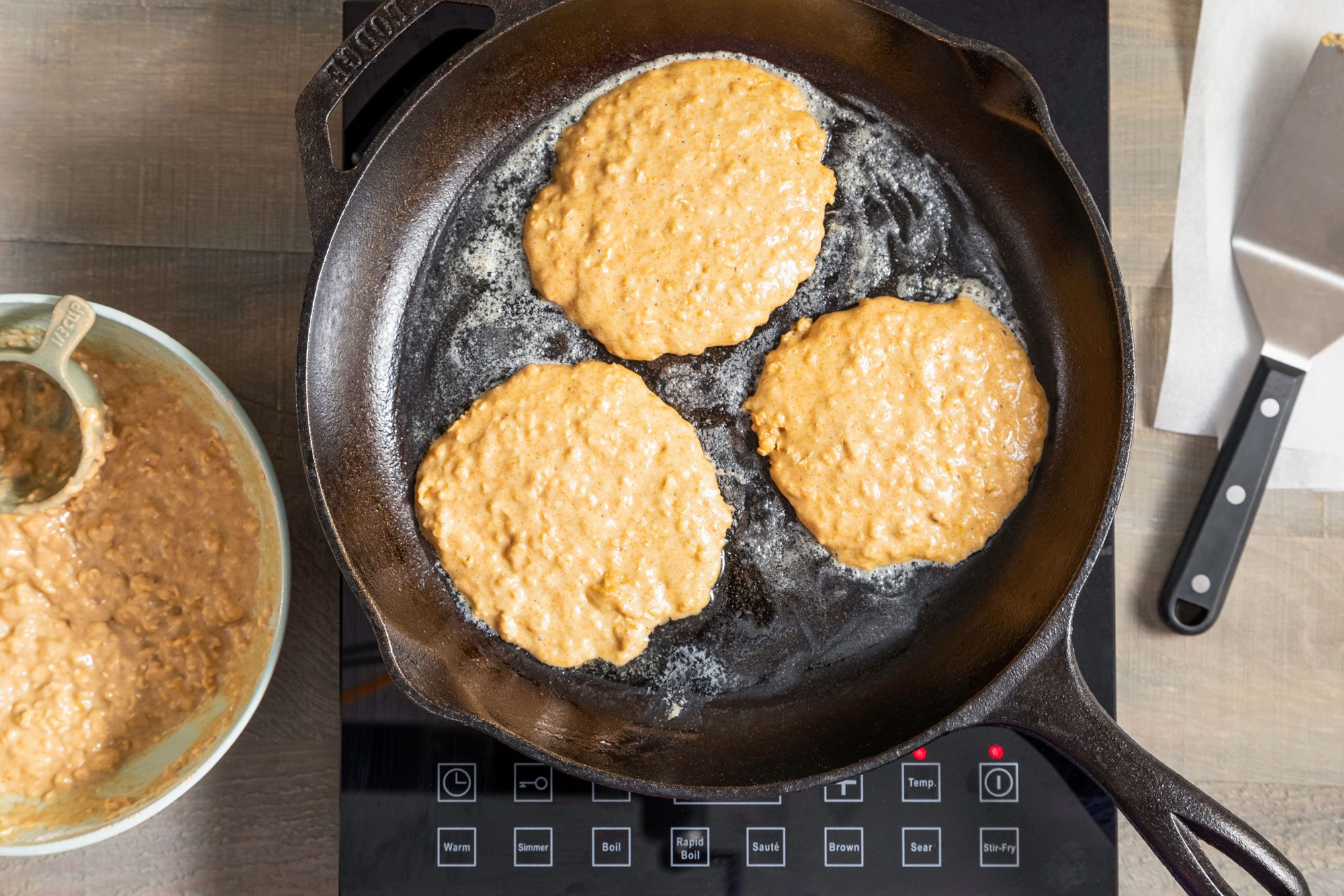 Cooking Oatmeal Pancakes on a Cast Iron Skillet on Induction Cooktop