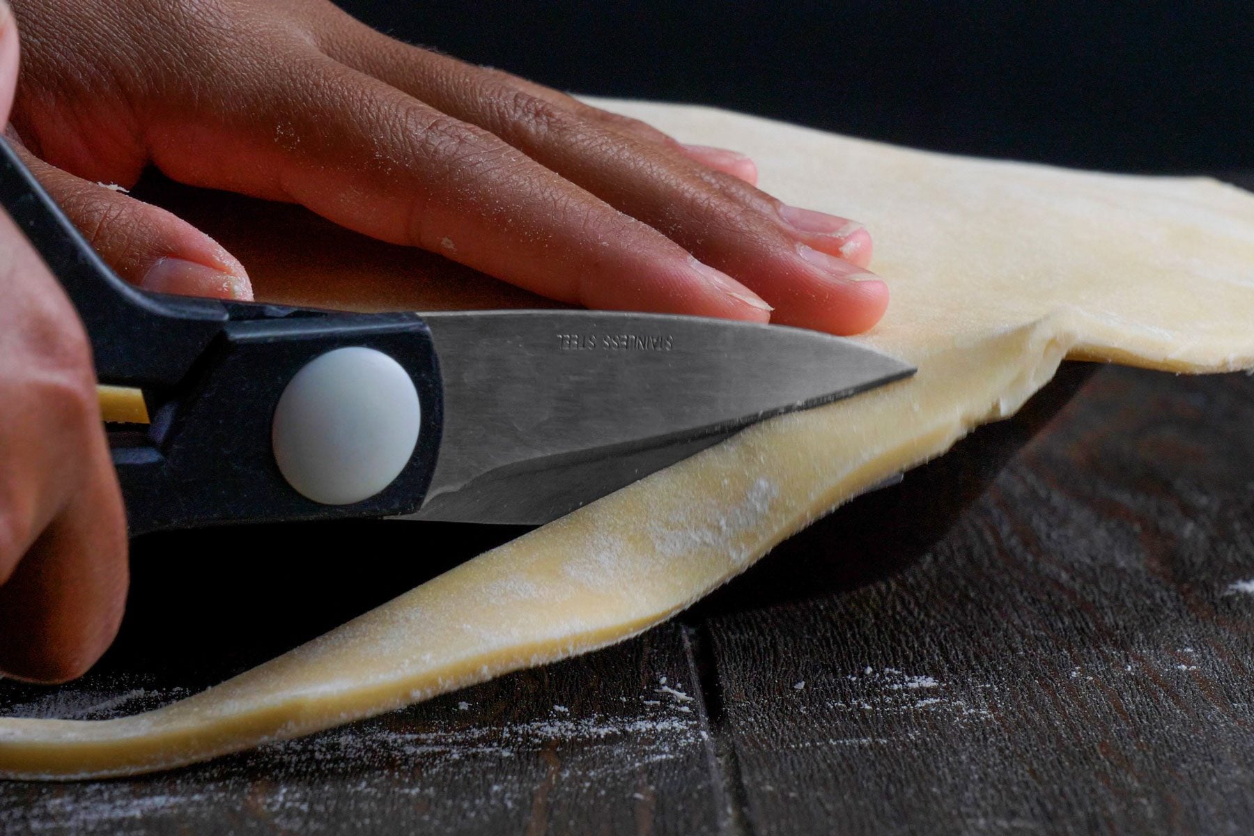 Pie crusts is Trimmed from edges to seal the pie plates