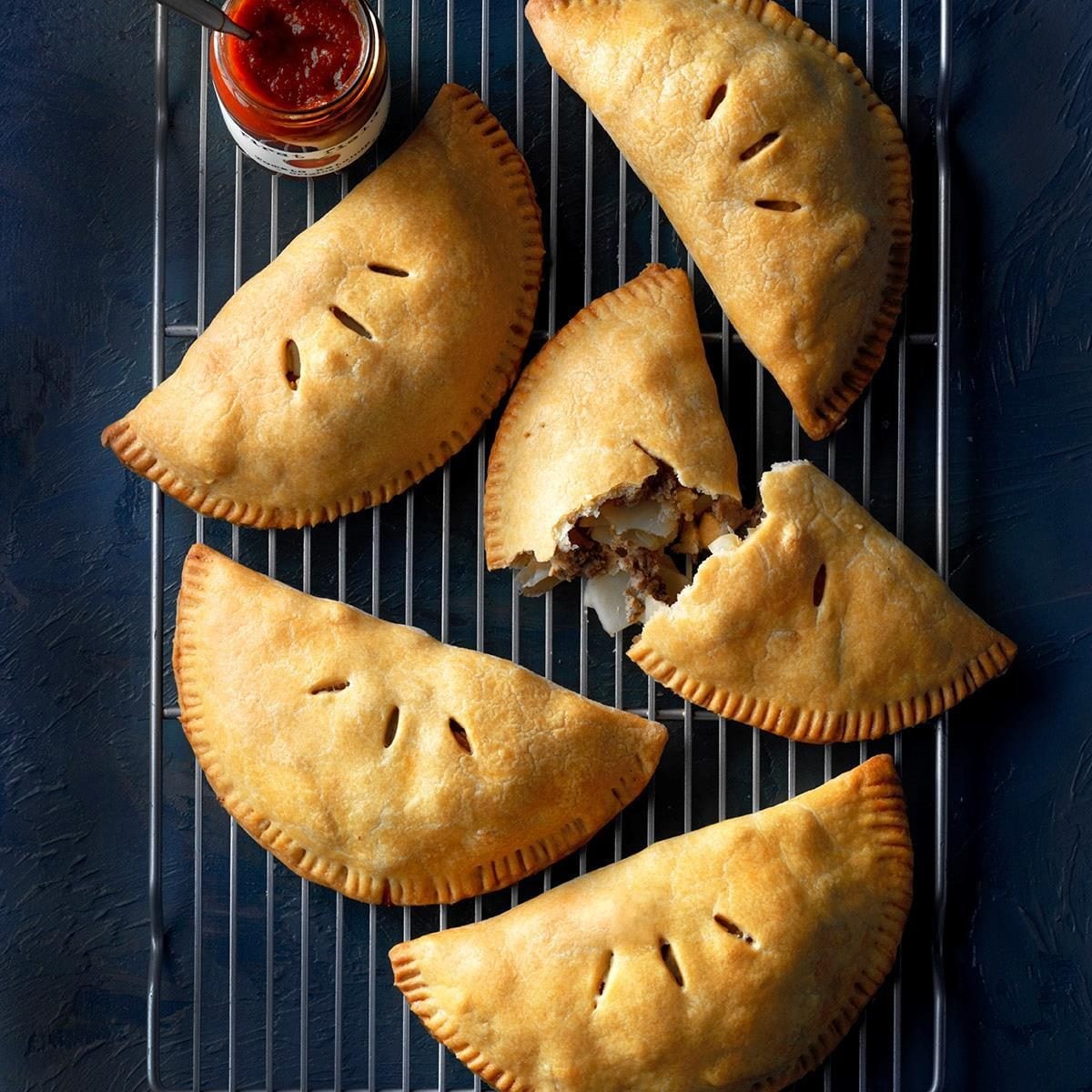 Upper Peninsula Pasties on wire rack with sauce