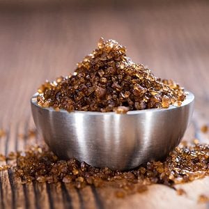 Portion of Smoked Salt on wooden background