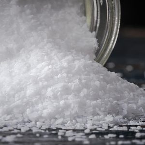 Kosher salt spilling from a spice jar