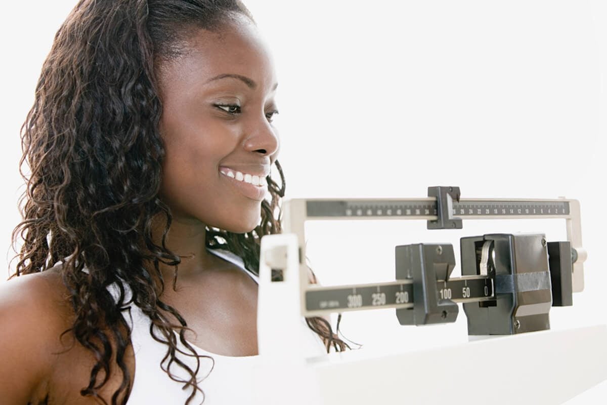 Woman weighing herself