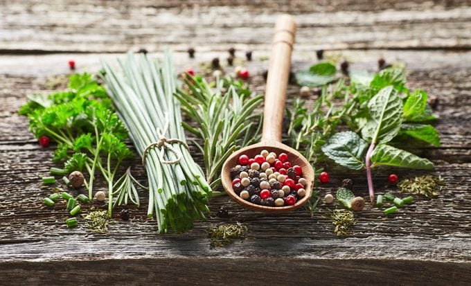 Keto-friendly Herbs and spices on a wooden background