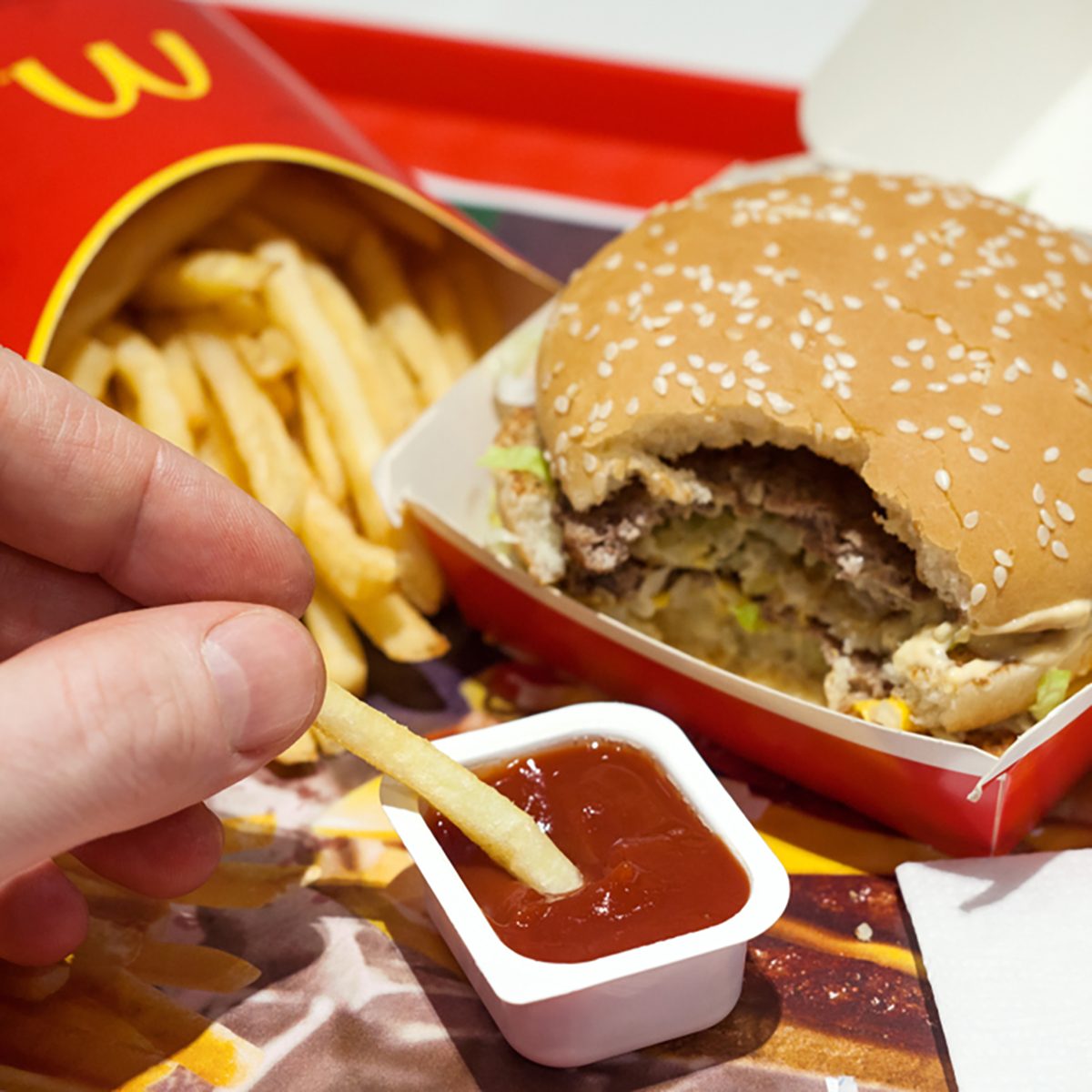 Minsk, Belarus, January 8, 2018: Man is eating at McDonald
