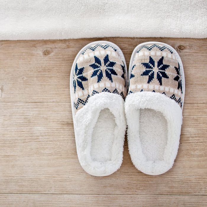Slippers at the side of a bed