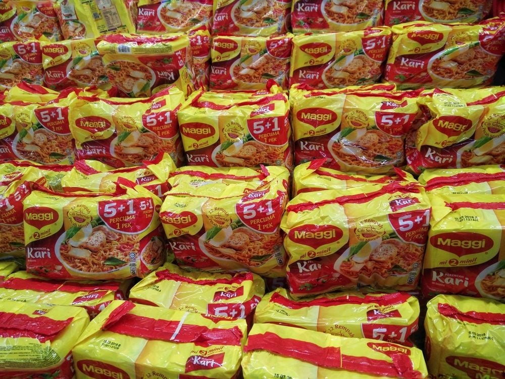 KUALA LUMPUR, MALAYSIA - 18 JUNE, 2017 : Maggi instant noodles. Owned by Nestle, Maggi is an international brand of soups, stocks, bouillon cubes, ketchup, sauces, seasonings and instant noodles.