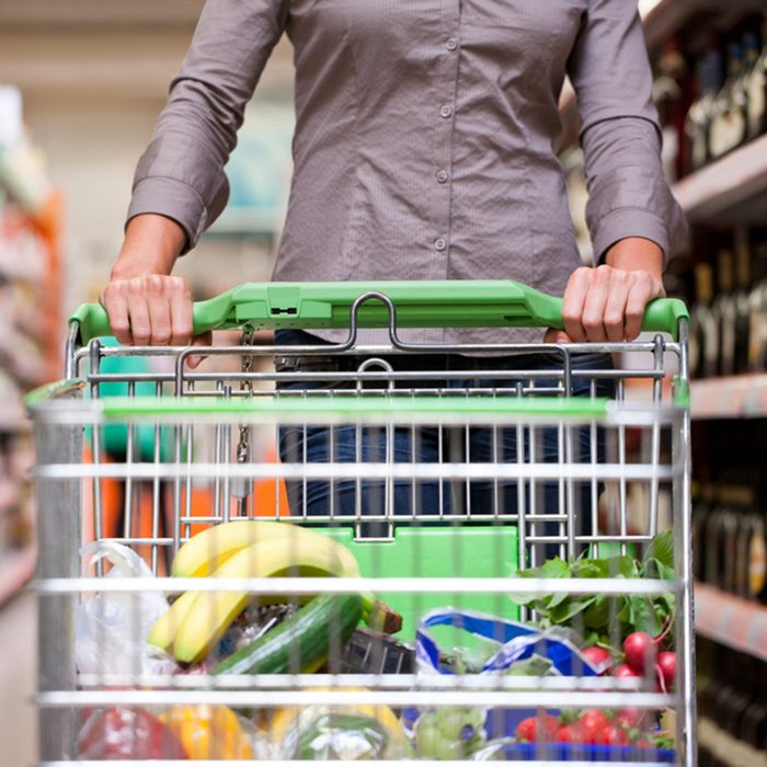 customer grocery shopping at supermarket