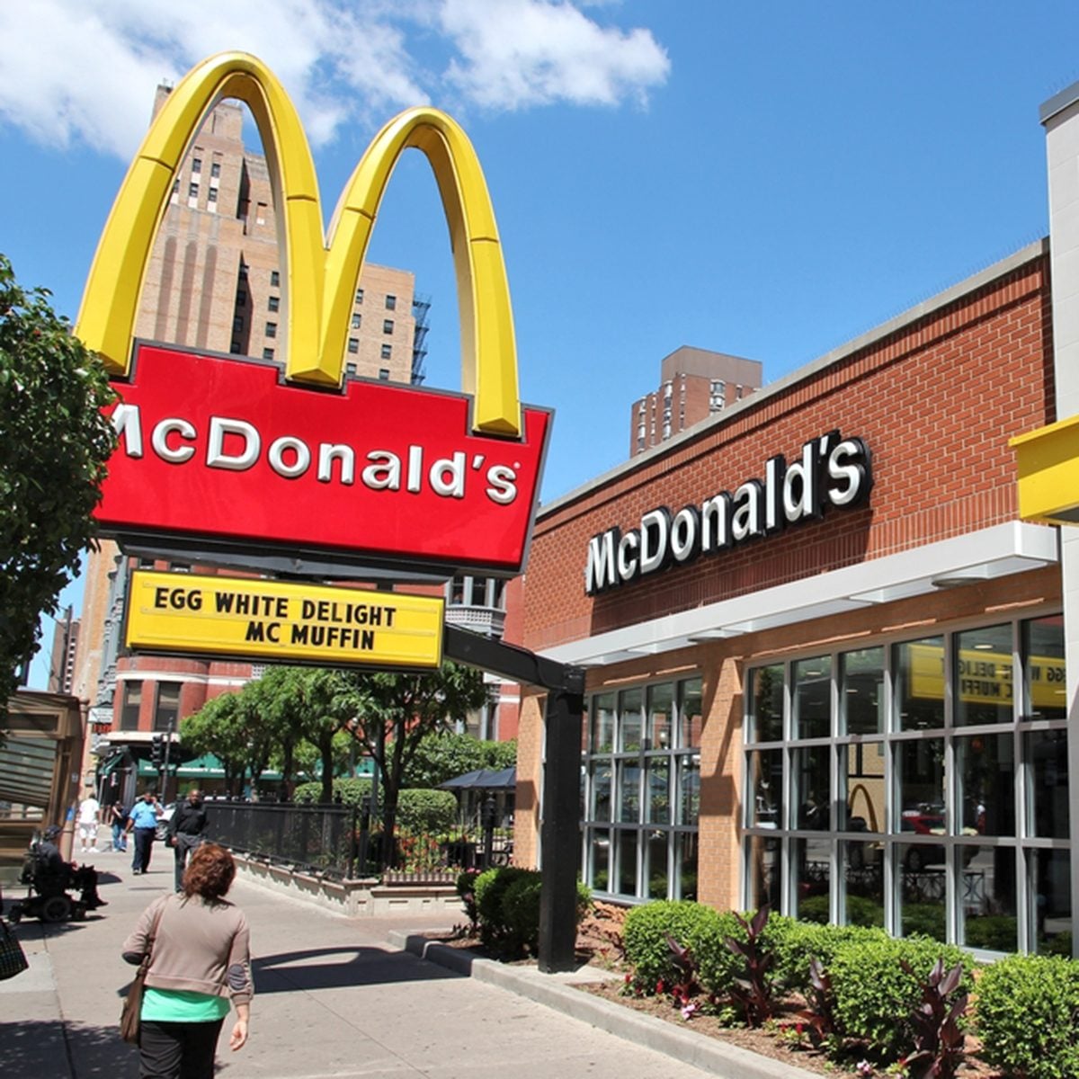 People walk by McDonald
