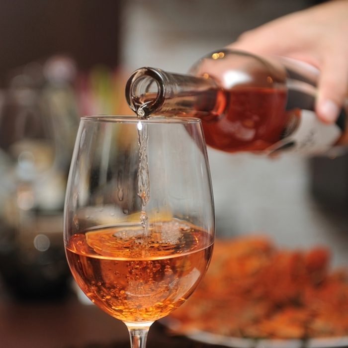 Wine is poured into a glass