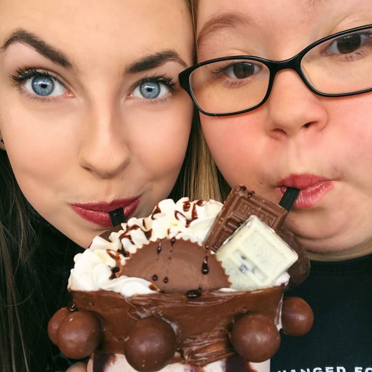 Sharing a milkshake
