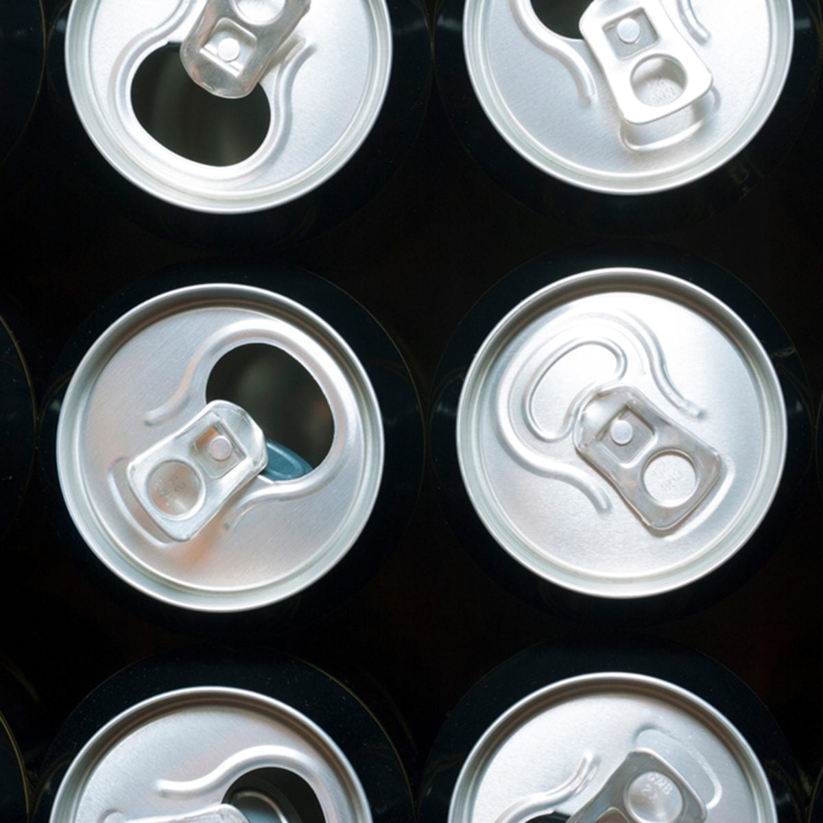 one closed and some opened black canned beer