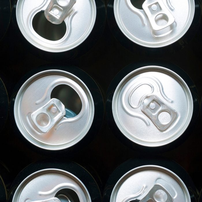 one closed and some opened black canned beer