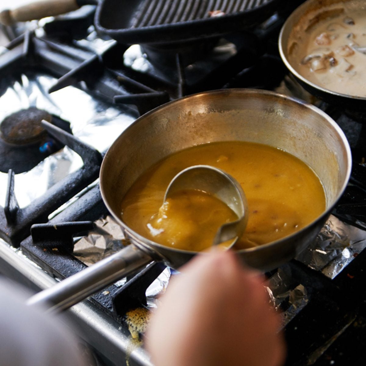 Making Gravy On The Restaurant Stove