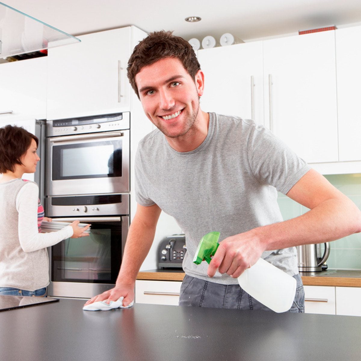 Man cleaning counters