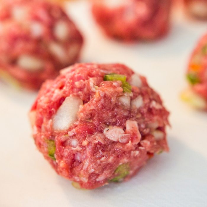Making meatballs in a kitchen