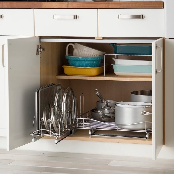 Sliding Pan And Lid Organizer inside a lower kitchen cabinet