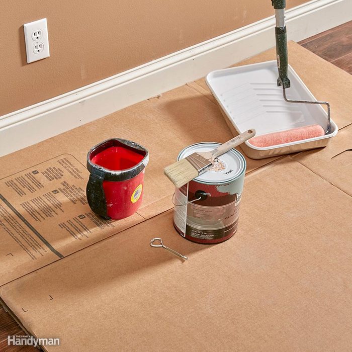 Cardboard on floor to protect it from paint