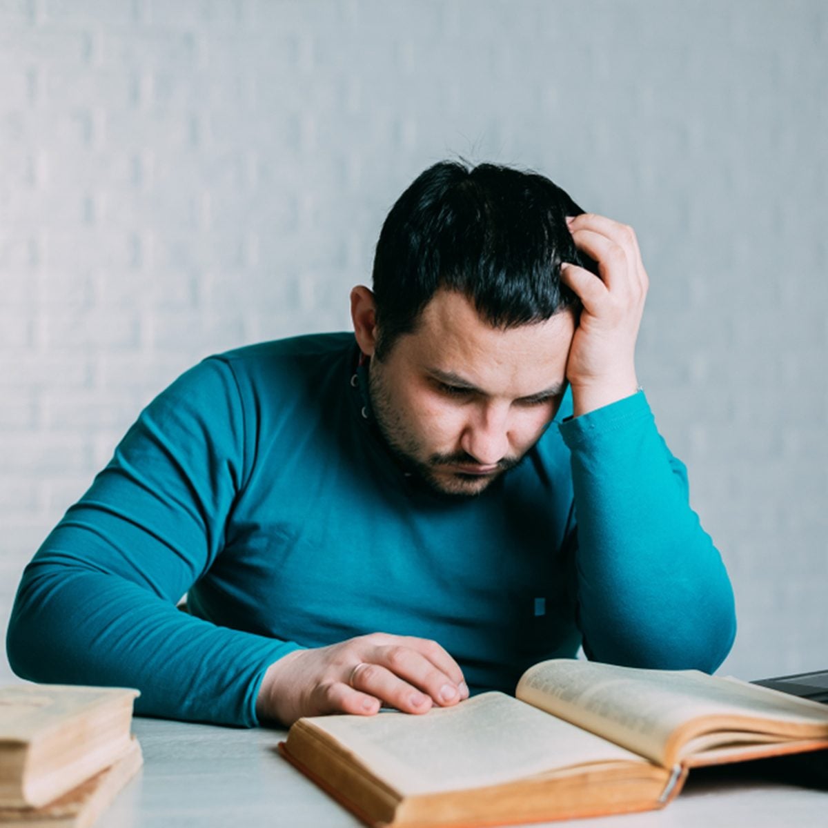 Man reading a book and nervous screams can