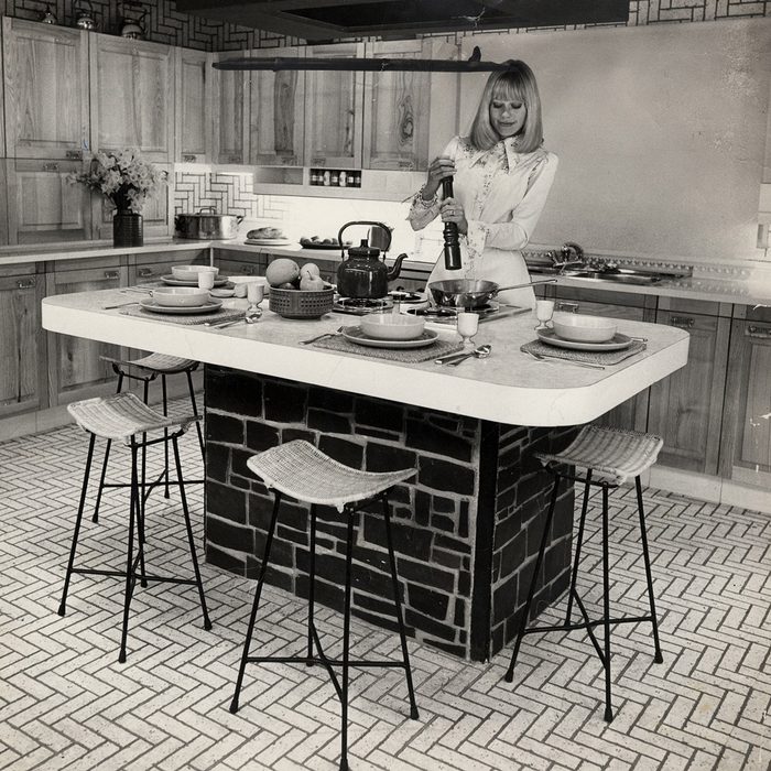 Picture Shows A Woman Cooking In A Kitchen On Show At The Exhibition.