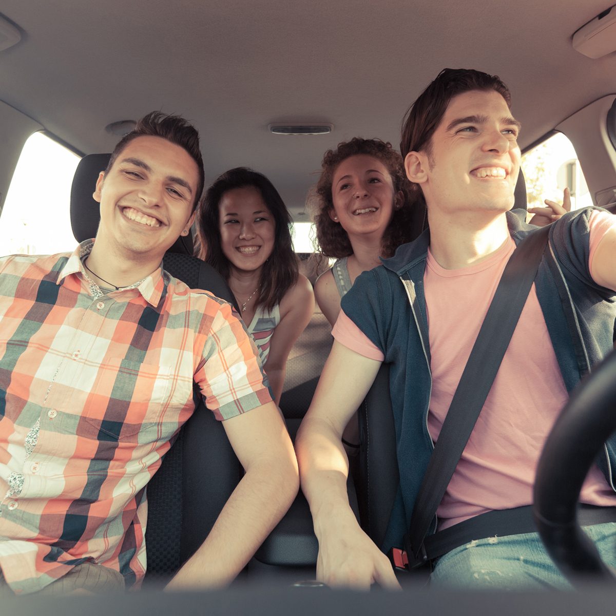 Four Friends in a Car Leaving For Vacation