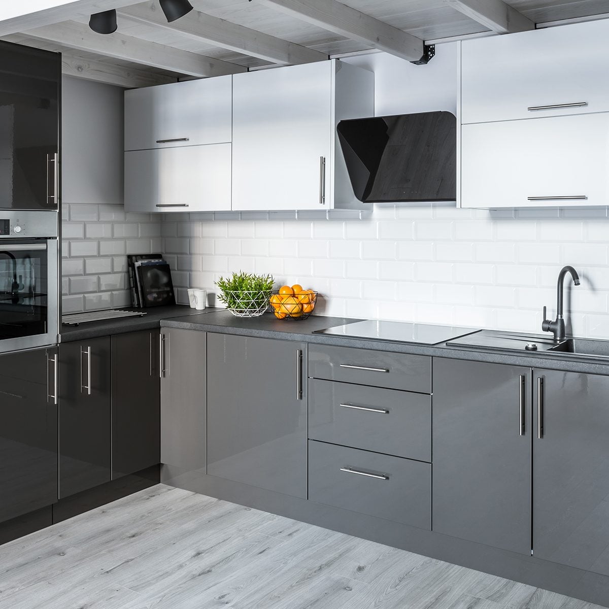 Modern kitchen with white brick tiles and wooden ceiling