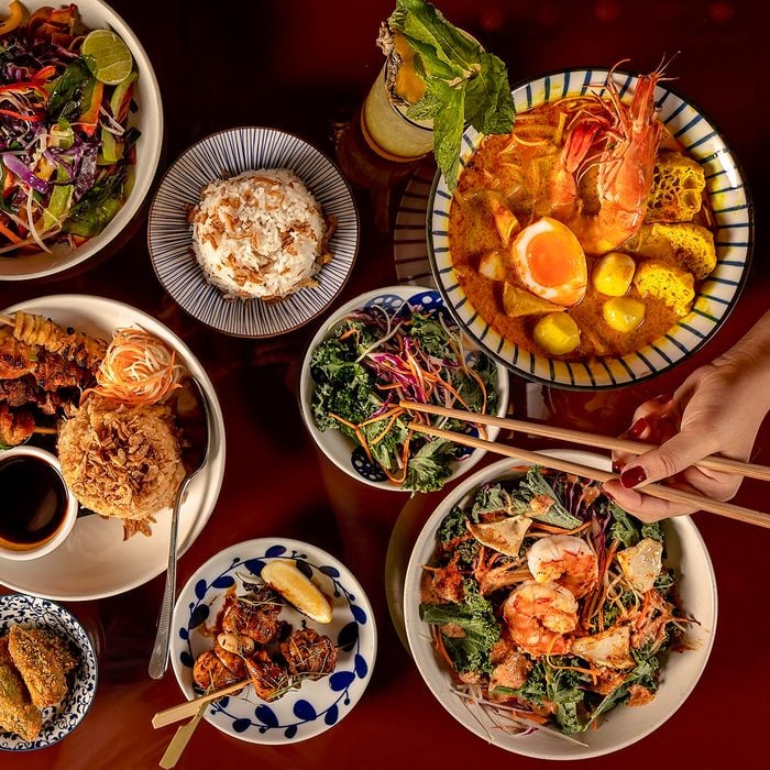 Thai food selection, top down view of multiple dishes.