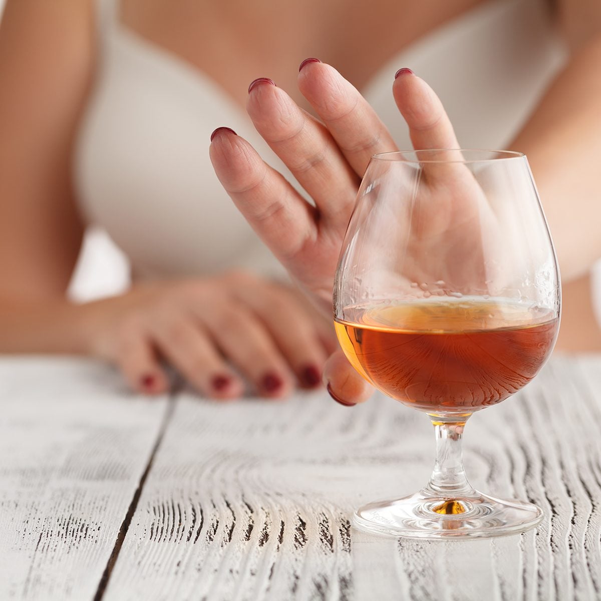 woman refuses to drink a alcohol