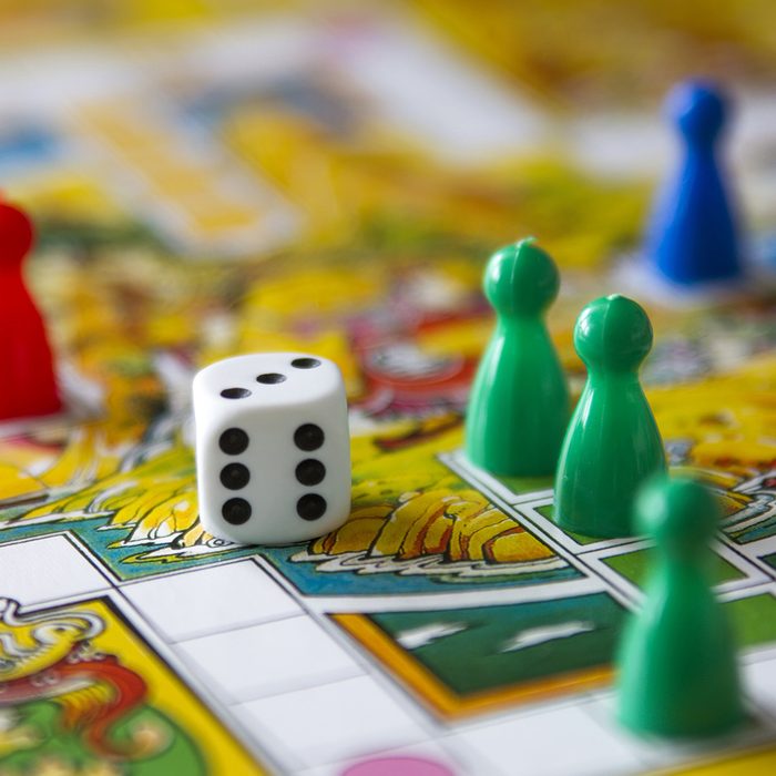 colorful play figures with dice on board