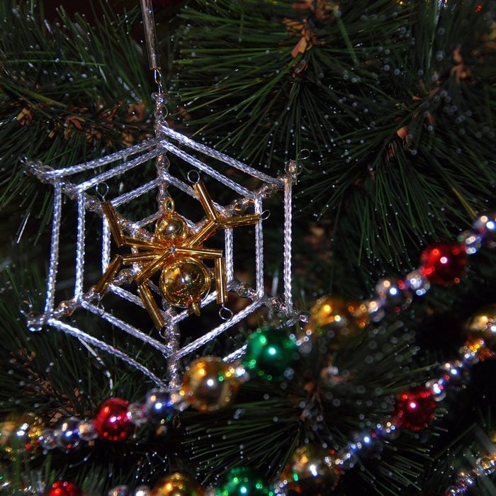 Pied bright shiny glass garland on the Christmas tree.