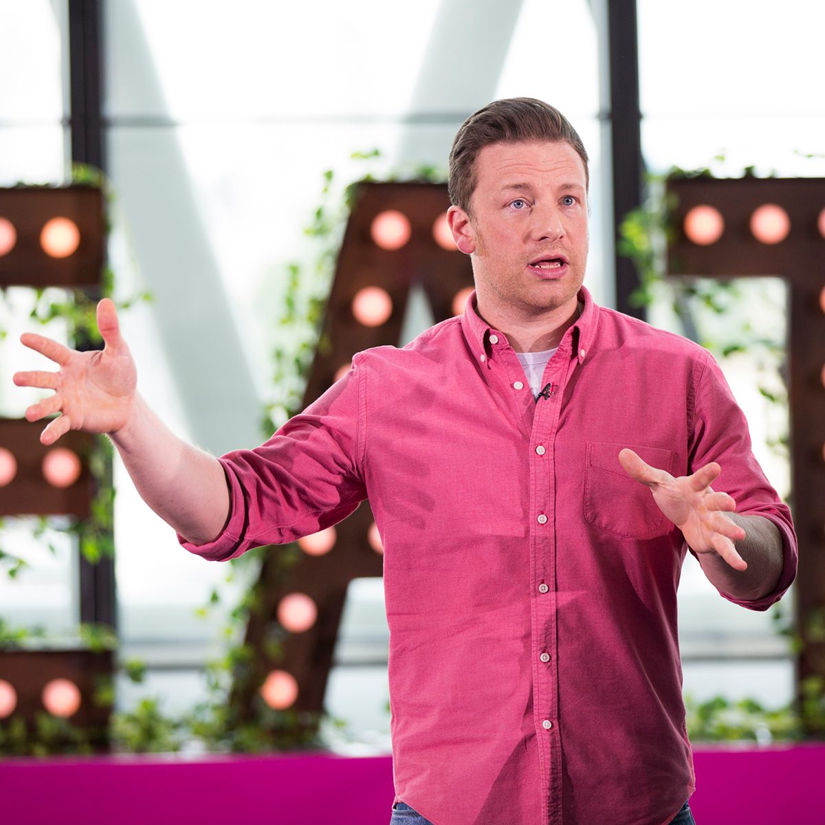 Jamie Oliver broadcasts a live cooking class from City Hall to school children across the globe as part of the third annual Food Revolution Day on May 16, 2014 in London, England. (Photo by Tristan Fewings/Getty Images)