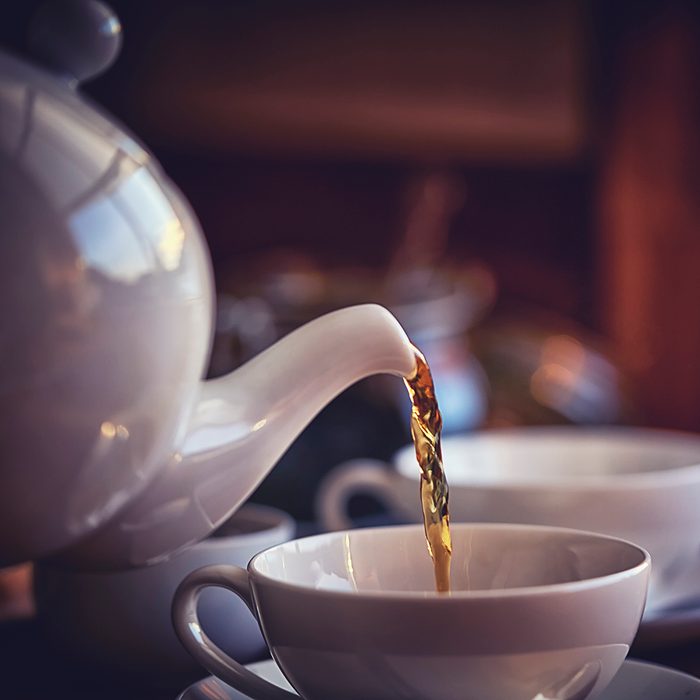 Cup of Black Tea Served with Biscuits
