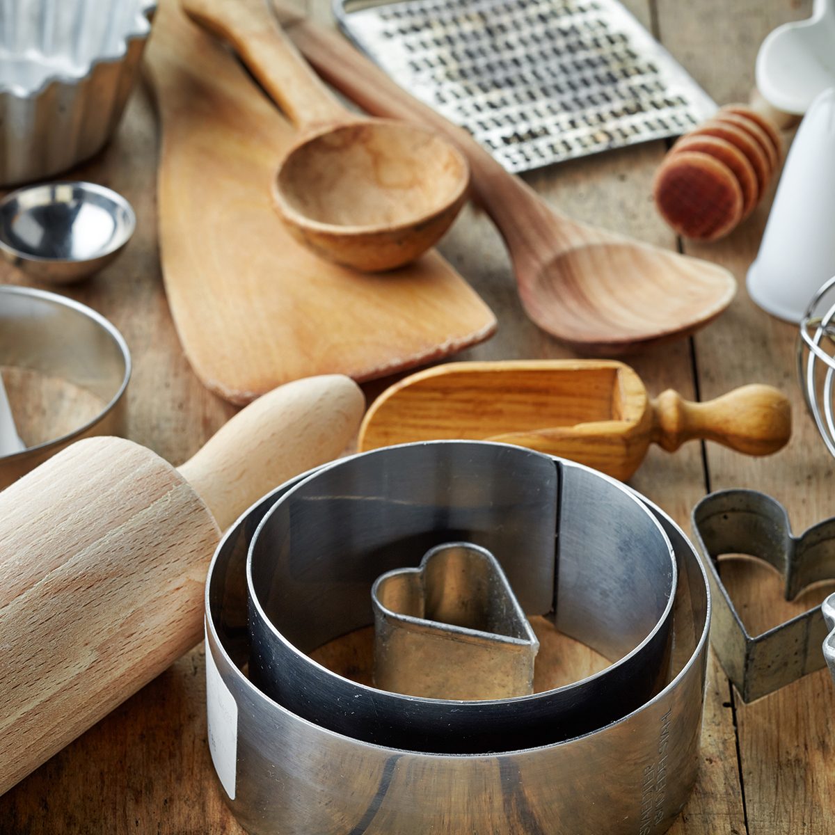 various kitchen utensils on wooden table