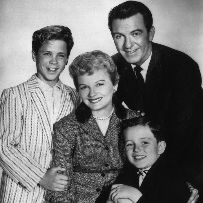 circa 1957: American actors (clockwise, from left) Tony Dow, Hugh Beaumont (1909 - 1982), Jerry Mathers, and Barbara Billingsley pose together in a promotional portrait for the television series,