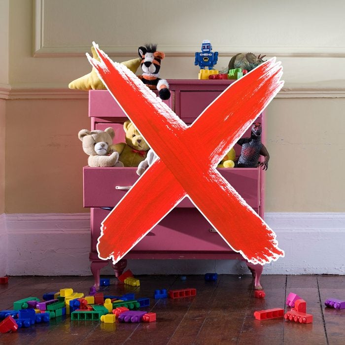 Dresser filled with toys and a red
