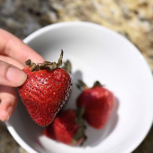 Holding a strawberry