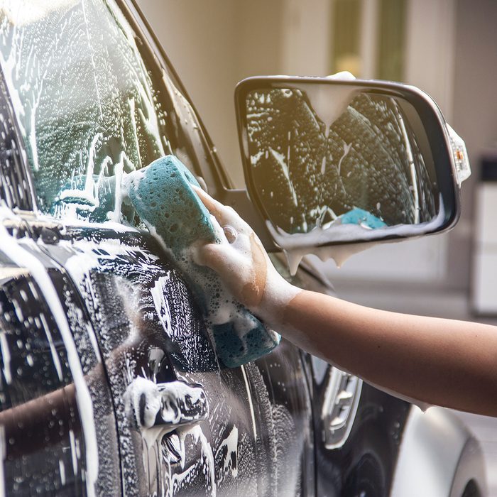 Cropped Hand Cleaning Car
