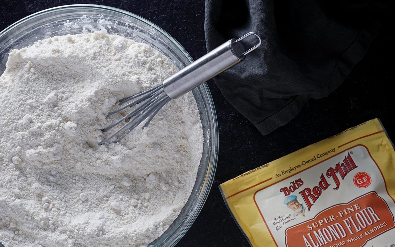 blending almond flour and powdered sugar for black forest uncake