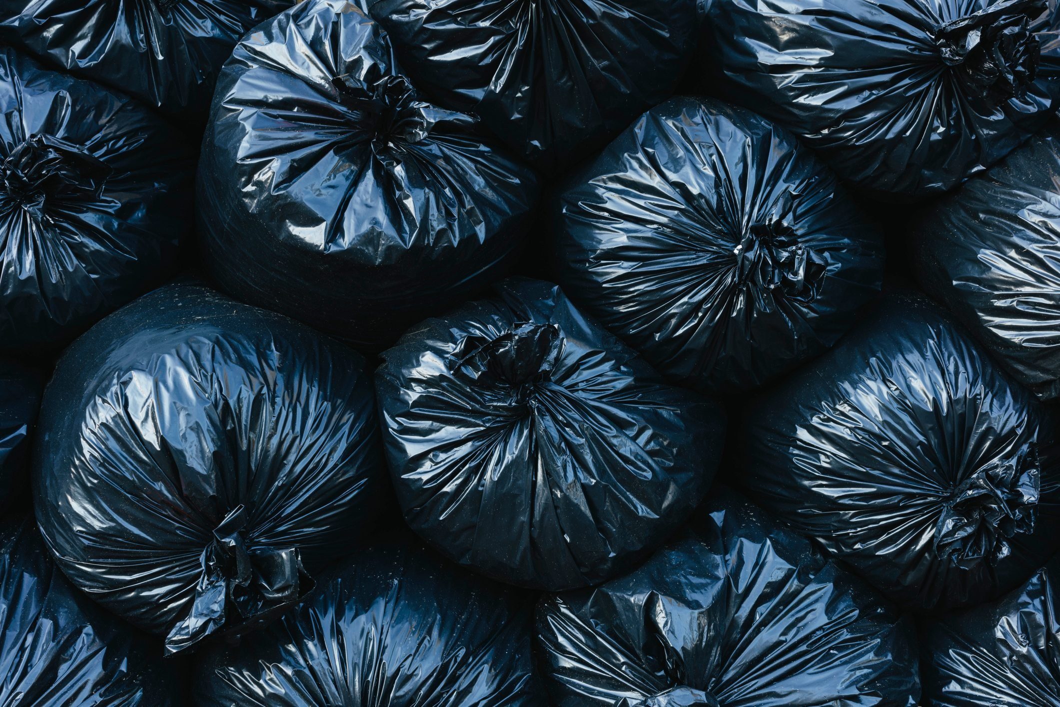 Black Trashbags stacked on top of one another