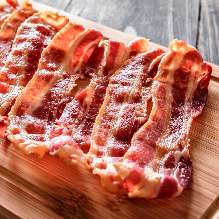 Roasted bacon on cutting board. Ingredient used in making Jam Bread or