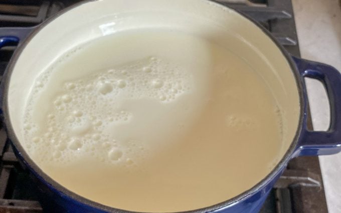 milk inside the dutch oven ready to be boiled