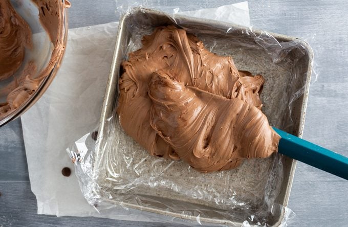 Cool Whip Candy being pressed into pan