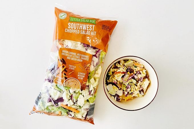 Little Salad Bar salad bag with a bowl of Salad
