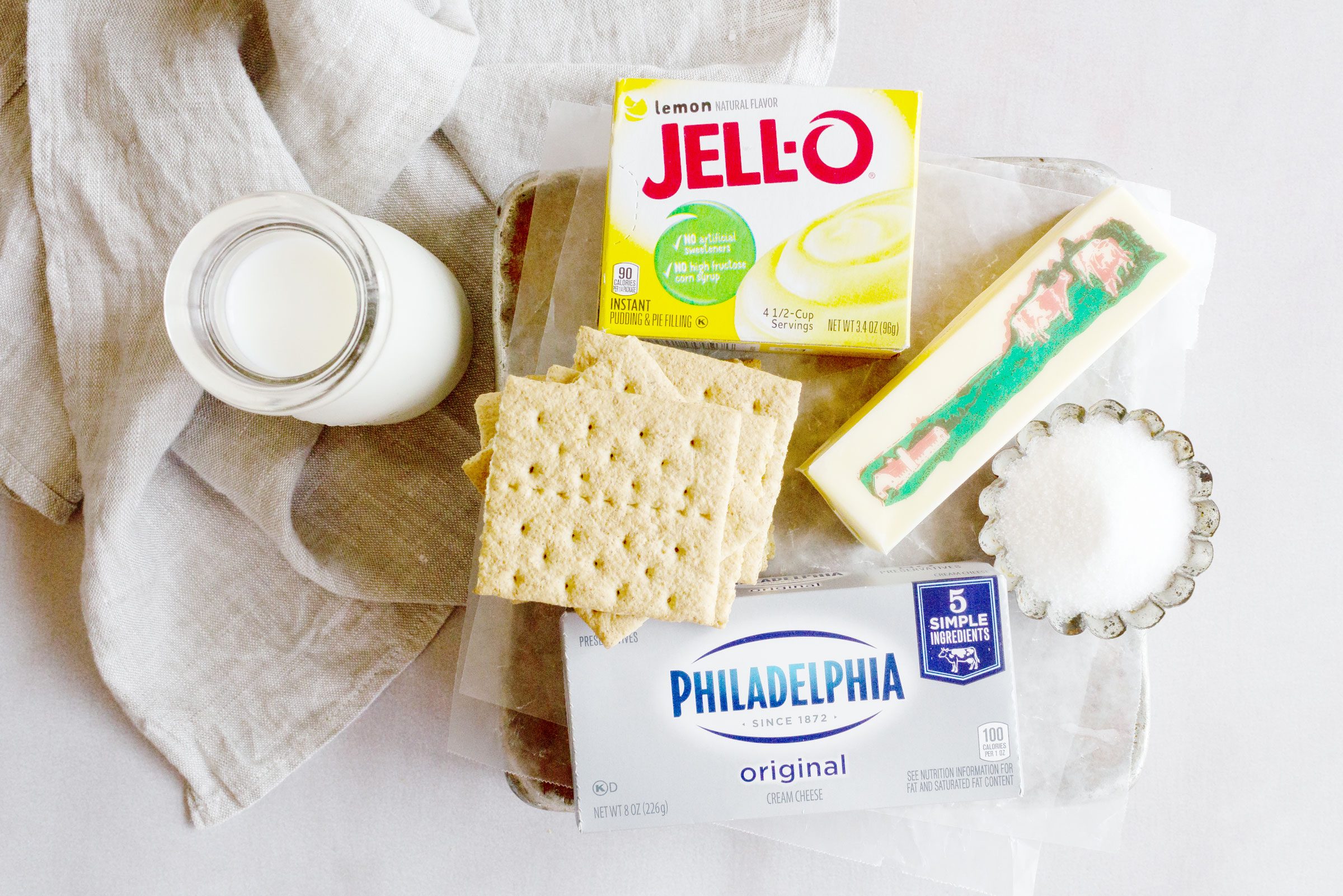 ingredients for No Bake Pudding Cheesecake on a kitchen counter