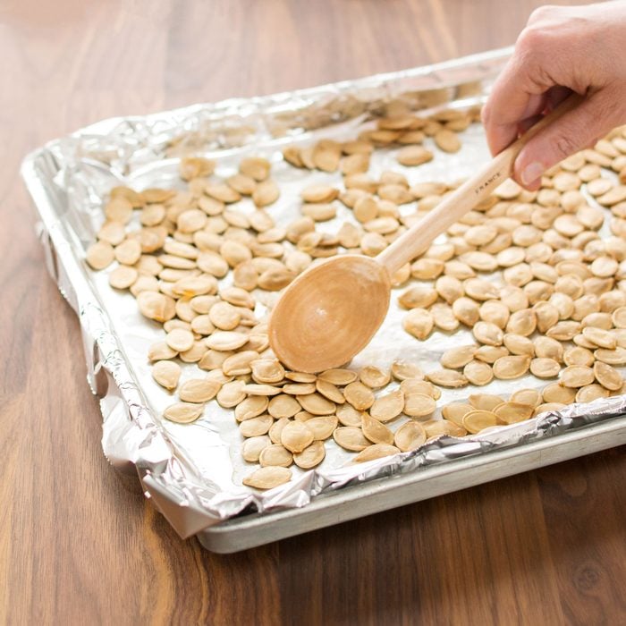 pumpkin seeds on a baking sheet