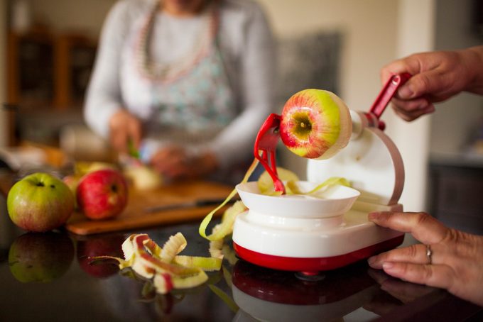 Person using apple peeler