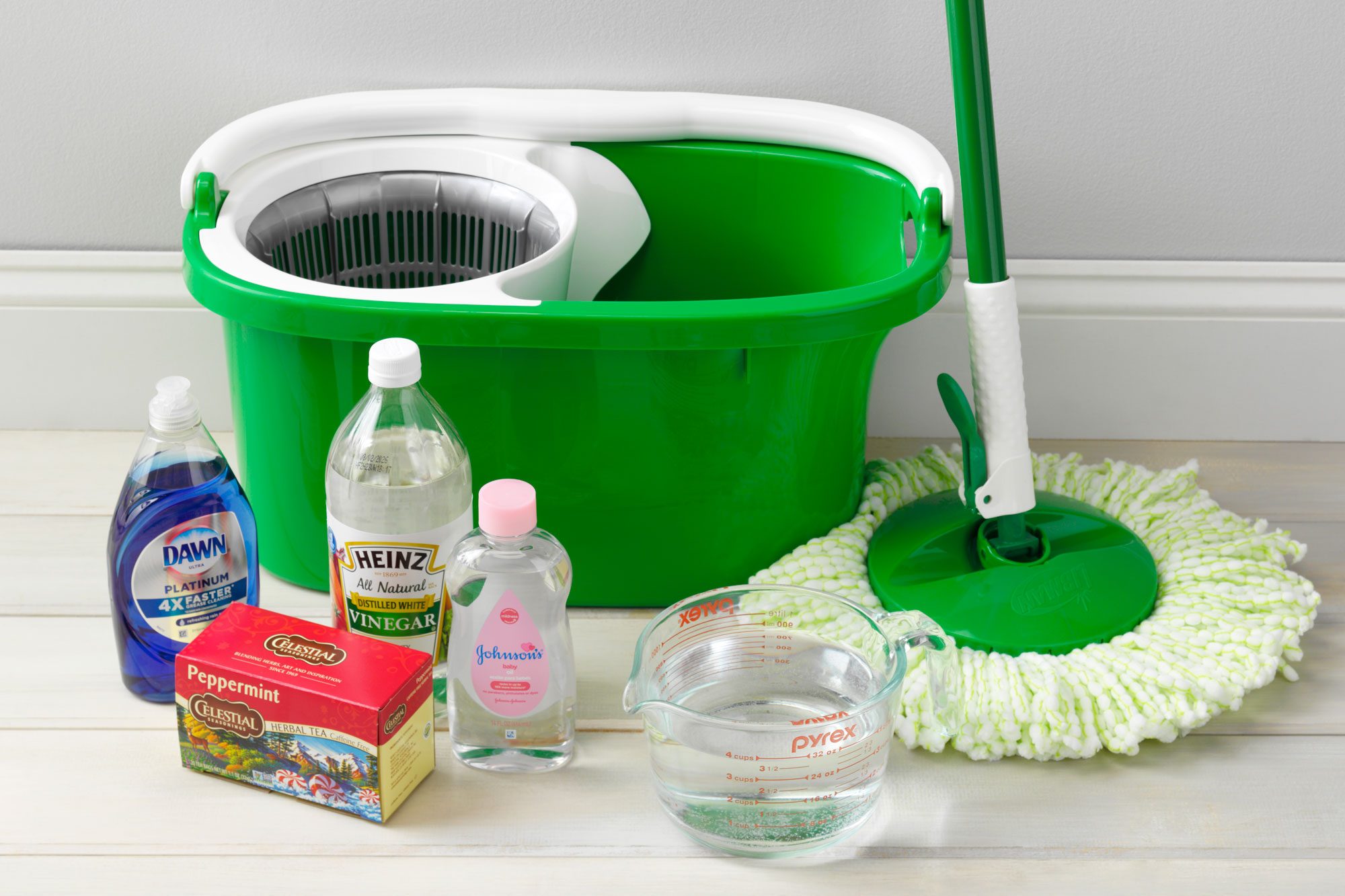 supplies for wood floor homemade cleaner arranged near a wall on a wood floor