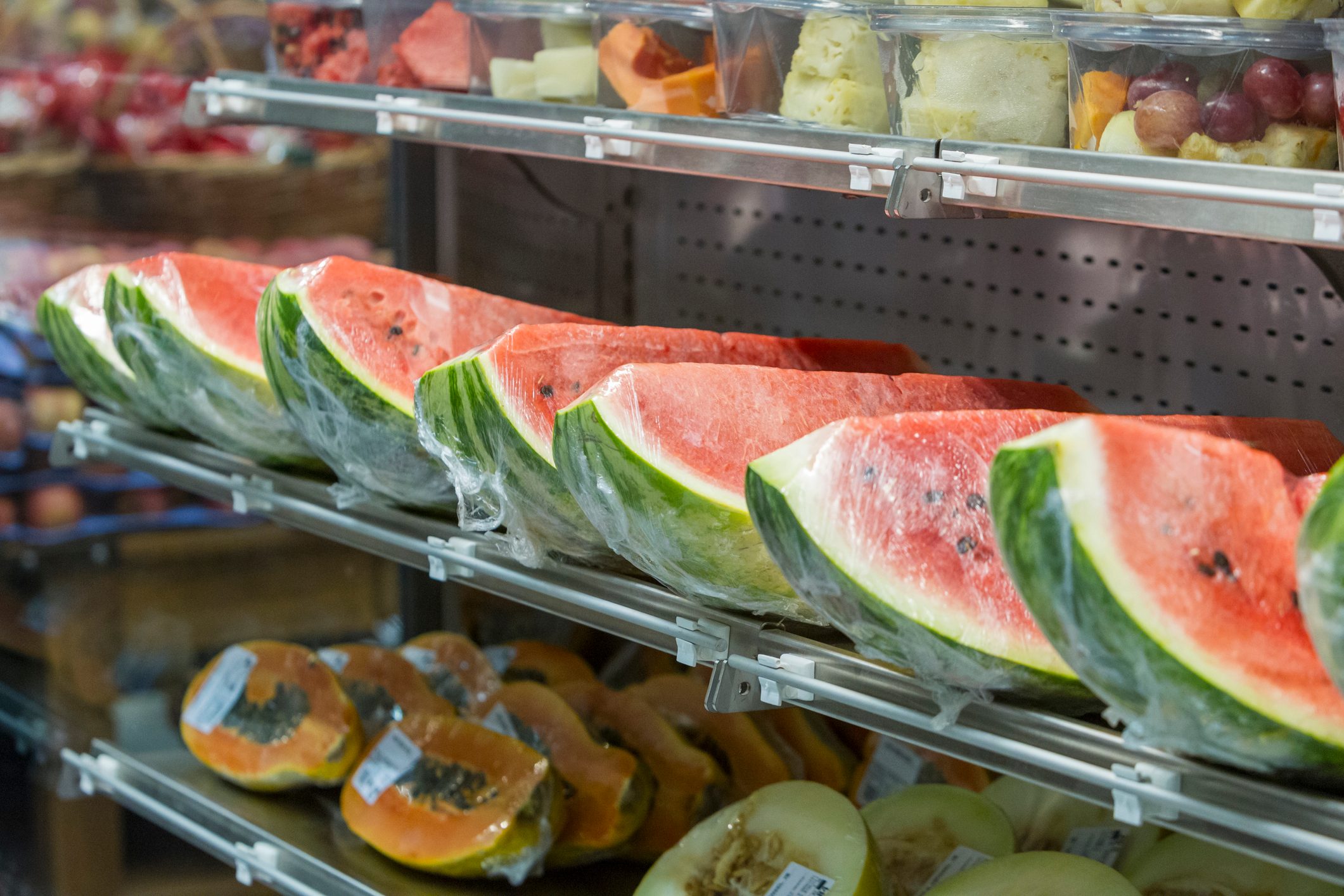 Watermelon, papaya, melon, pineapple grape, fruit on the market shelf.